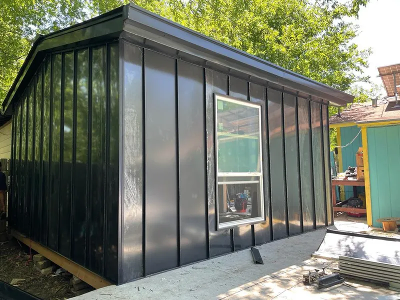 Black standing seam metal wall panels for Roof Inspection in Evesham